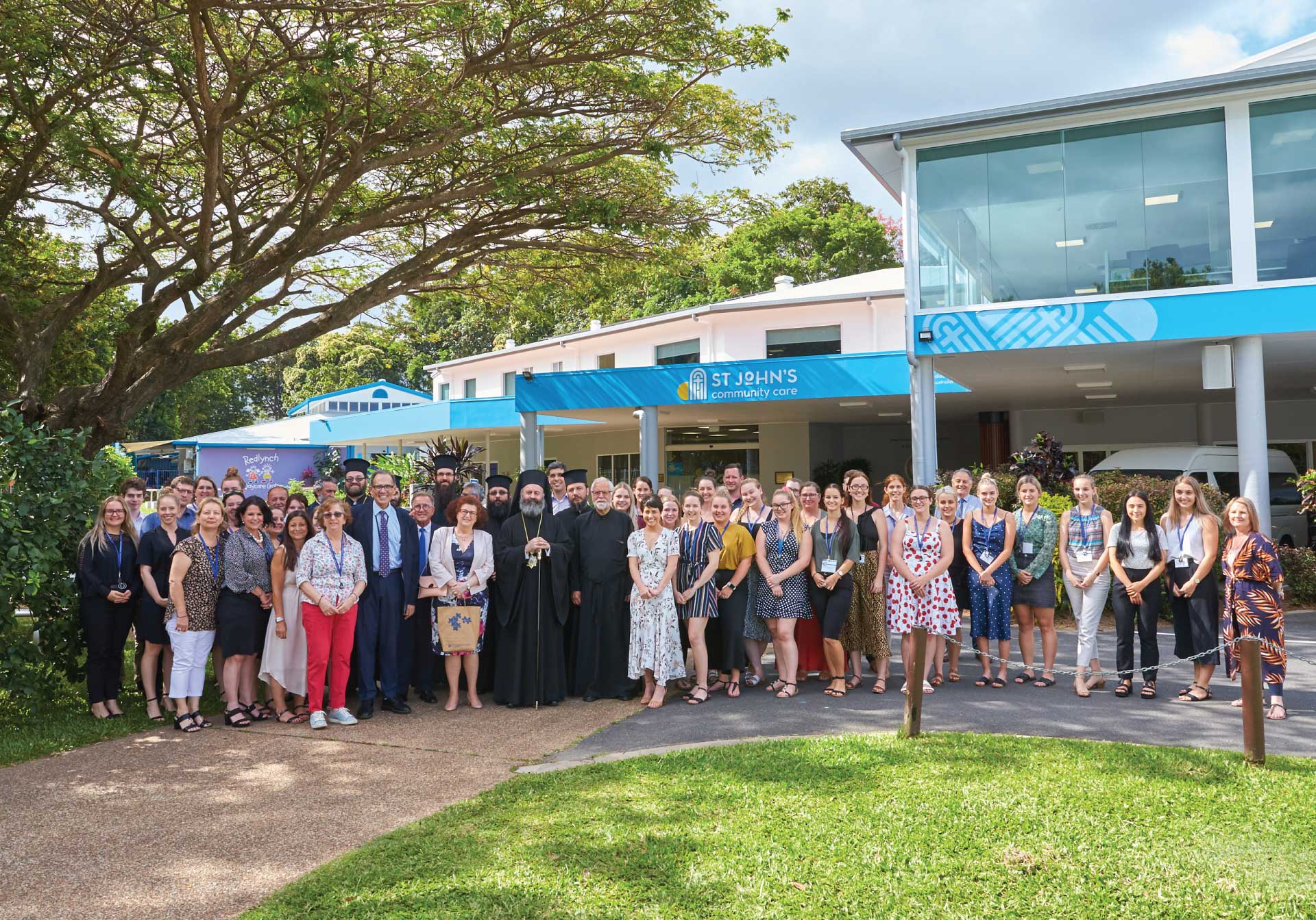 St John's Community Care staff in front of building