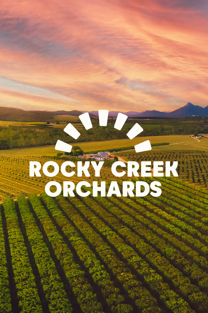 Rocky Creek Orchards Brandmark on photograph of sunset over orchards