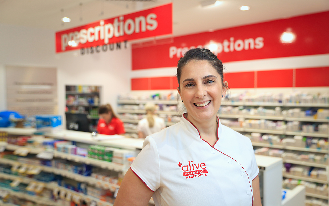 Alive Pharmacy rebrand store signage and uniform